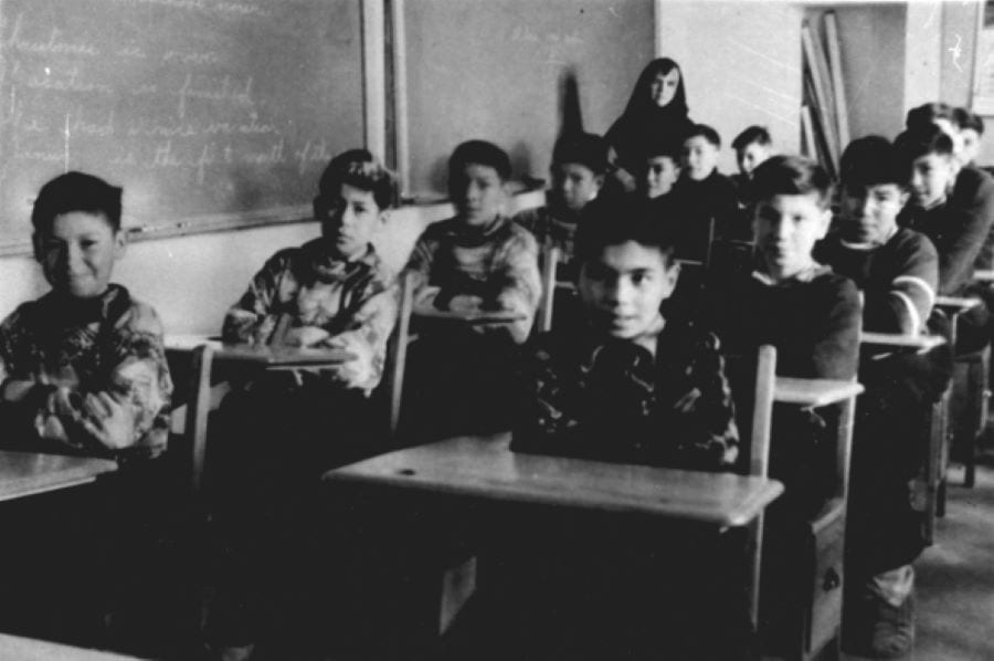 Boys in a classroom at an Indigenous Canadian residential school