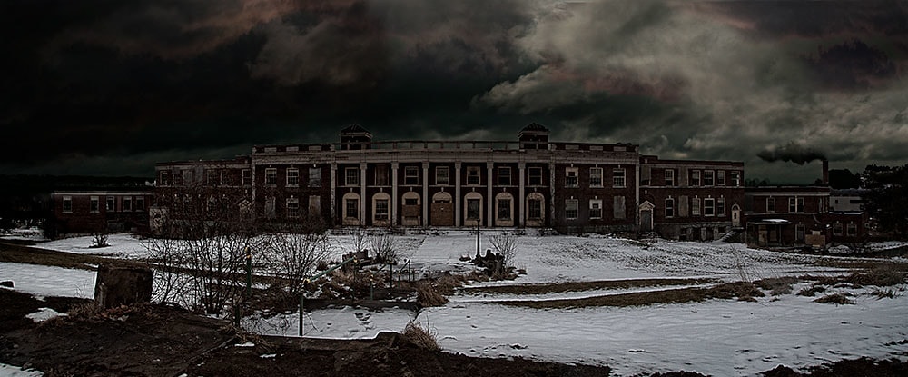 Abandoned tuberculosis hospital building at night