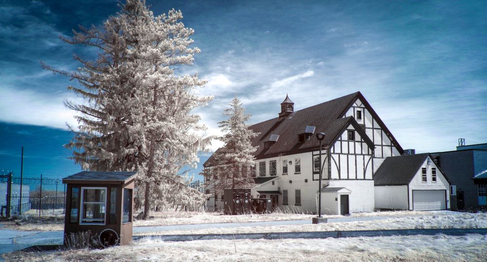 Half-timber, two - to- three story building in winter setting